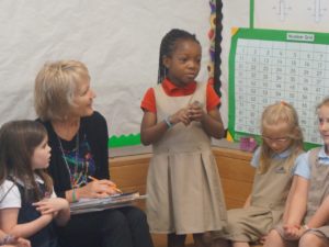 Children sitting in Christian Kindergarten classroom.