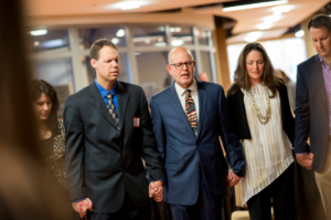 The Remember America team prays together before our 2016 Remember America Speaker Series event.