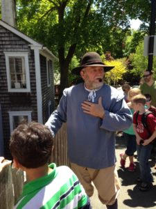 Leo the Miller of the Jenney Museum speaks to students on a tour of Plymouth.