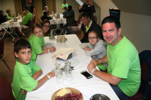 Visitors experience a Thanksgiving dinner as the Pilgrims would have at Plimoth Plantation.