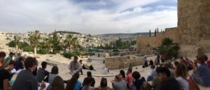 Students, teachers, and alumni learn during their field study to Israel.