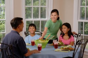 Children learn responsibility when their parents interact with them at the dinner table.