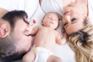 A young couple with their baby - christians in public school