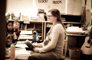 A Dayspring teacher reads to her class. 