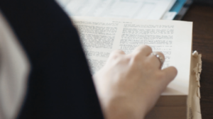 A female student at Dayspring Christian Academy in Lancaster, PA studies a book written in Greek.