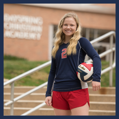 Female Christian High School Sports Team Player with Volleyball