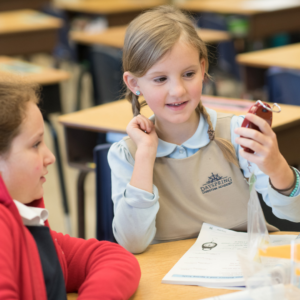 Two Dayspring lower school girl students solving a class problem together