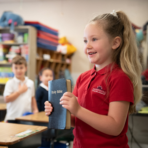 Student holding bible