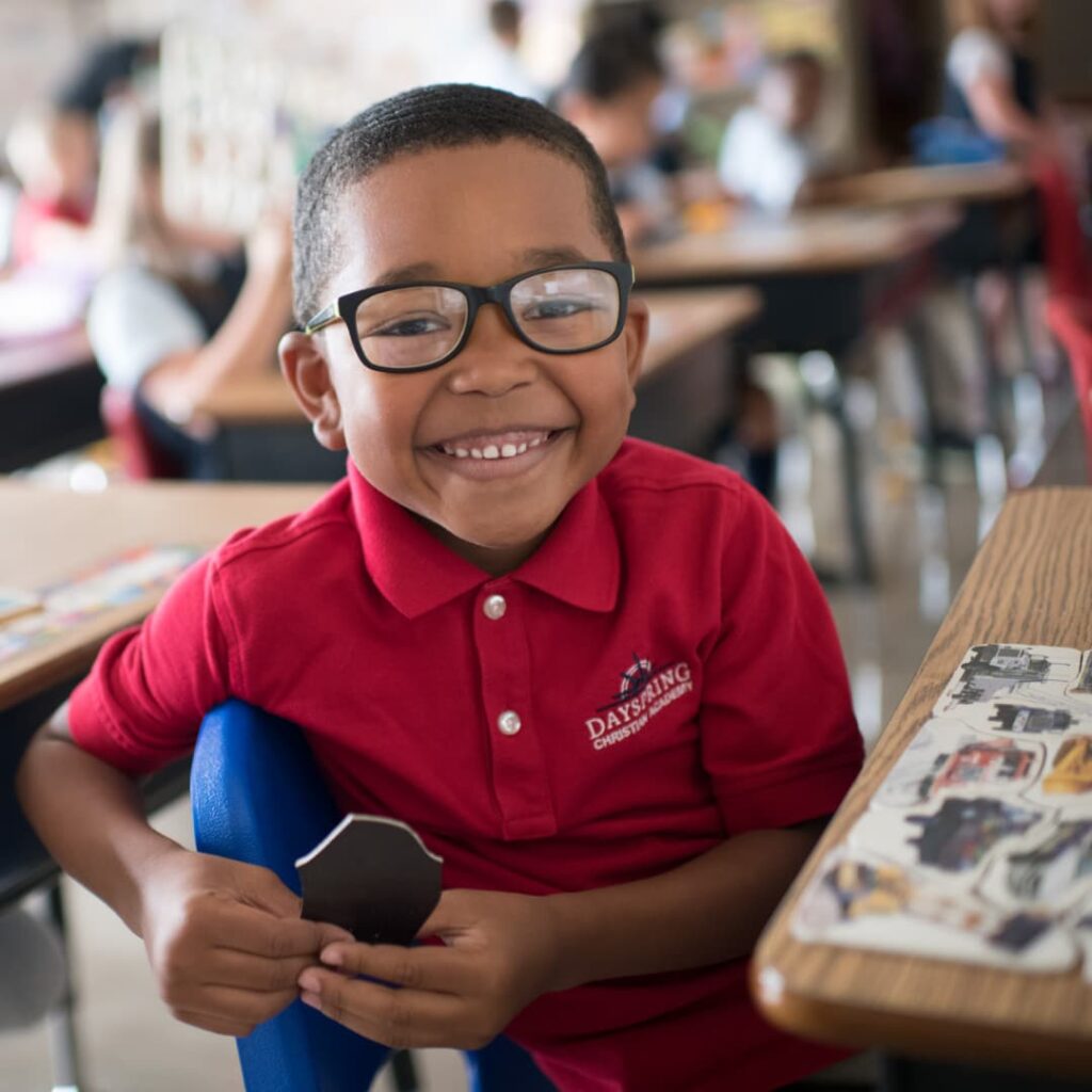 A smiling kindergarten student at Dayspring Christian Academy in Lancaster, PA